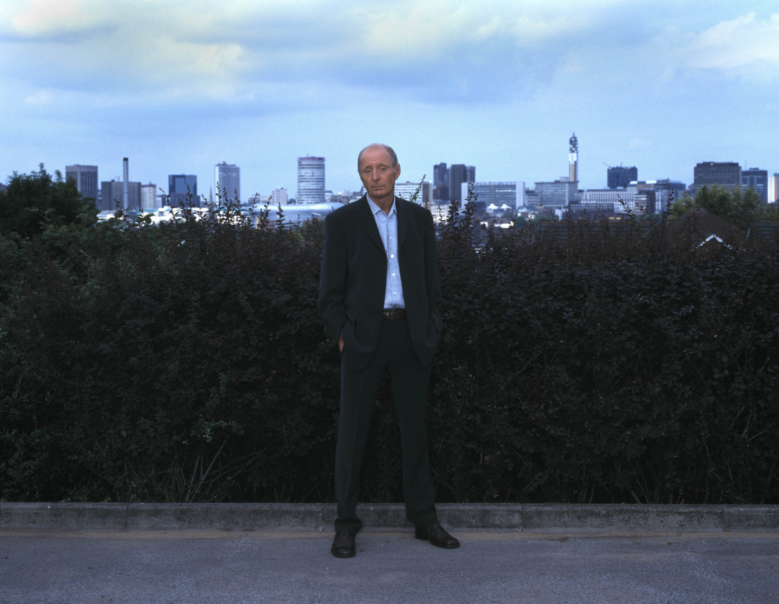 Jasper Carrott with Birmgham skyline behind him