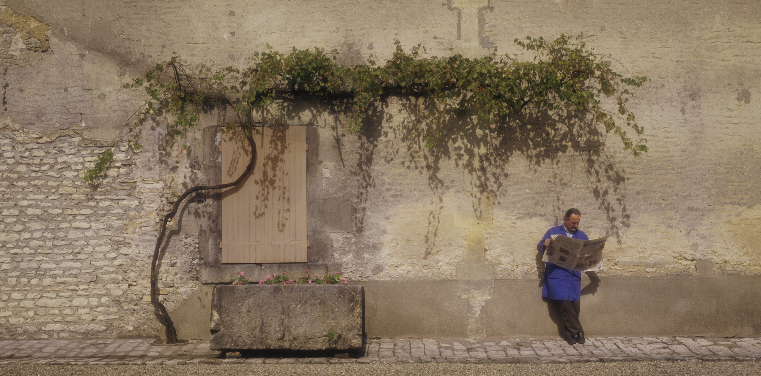 Camus worker, resting in courtyard