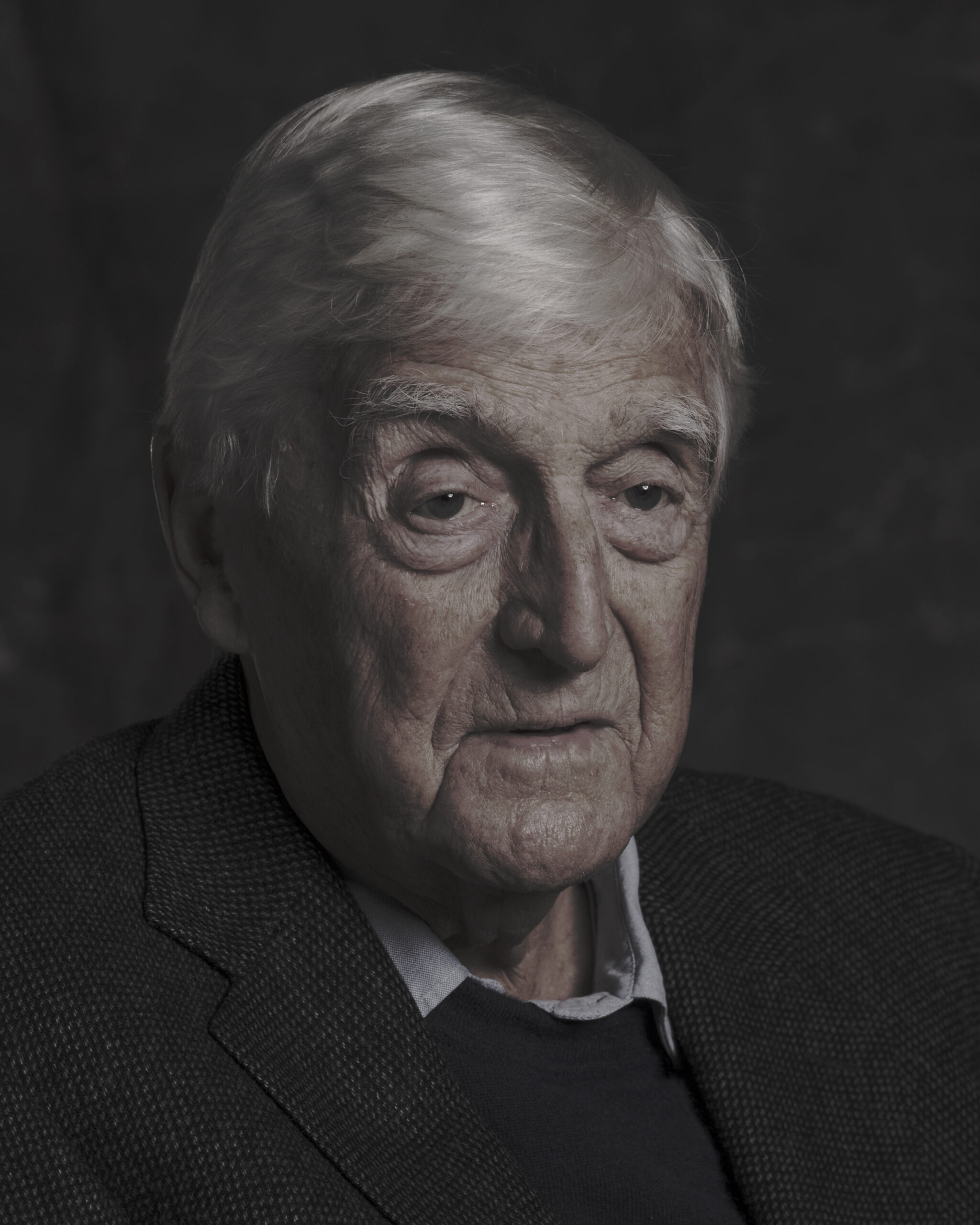 moody headshot of Sir Michael Parkinson