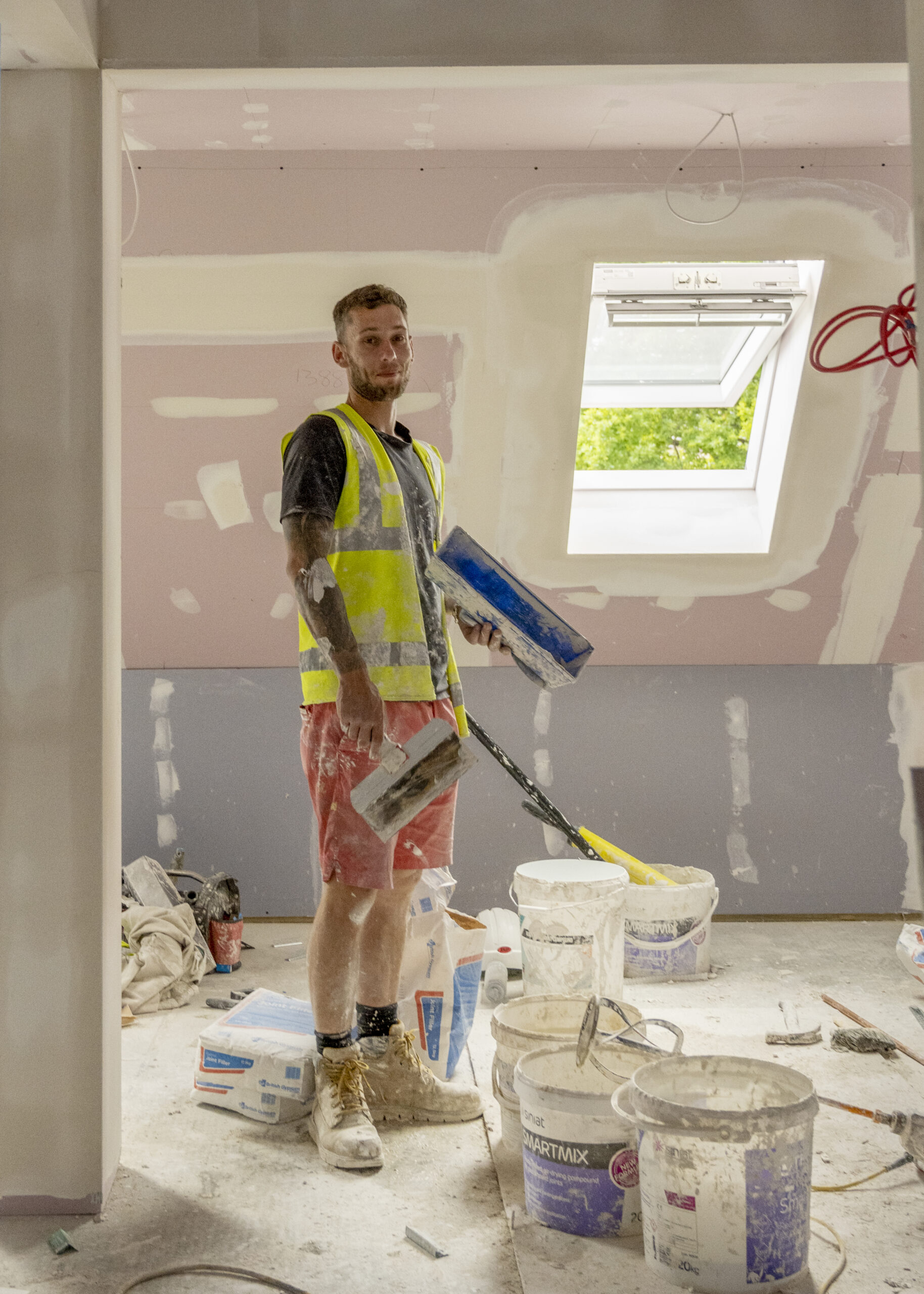 Plaster in room that is been plastered - buckets around with mess