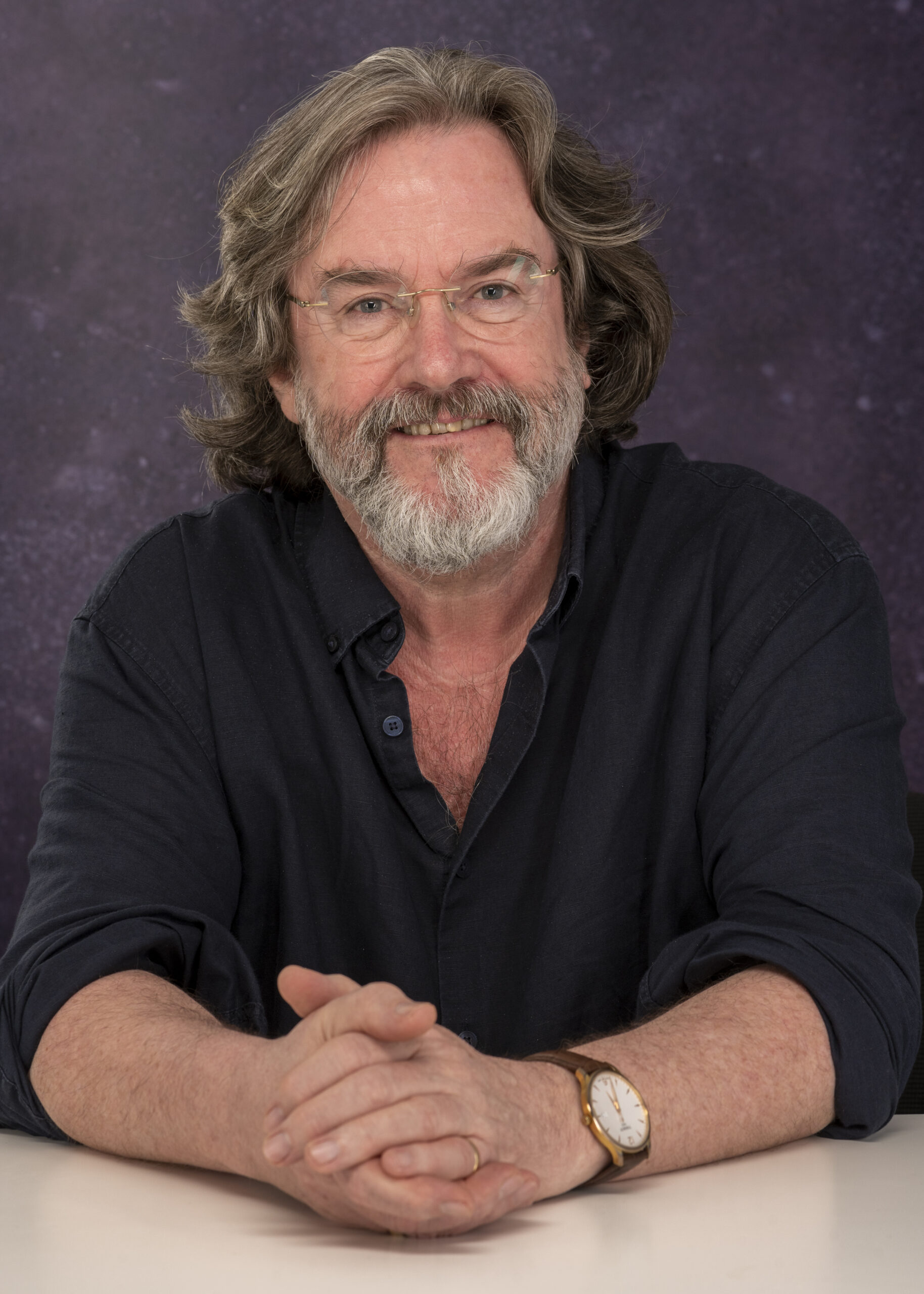 Greg Doran, RSC, smiling to camera with beard. Portrait photograph